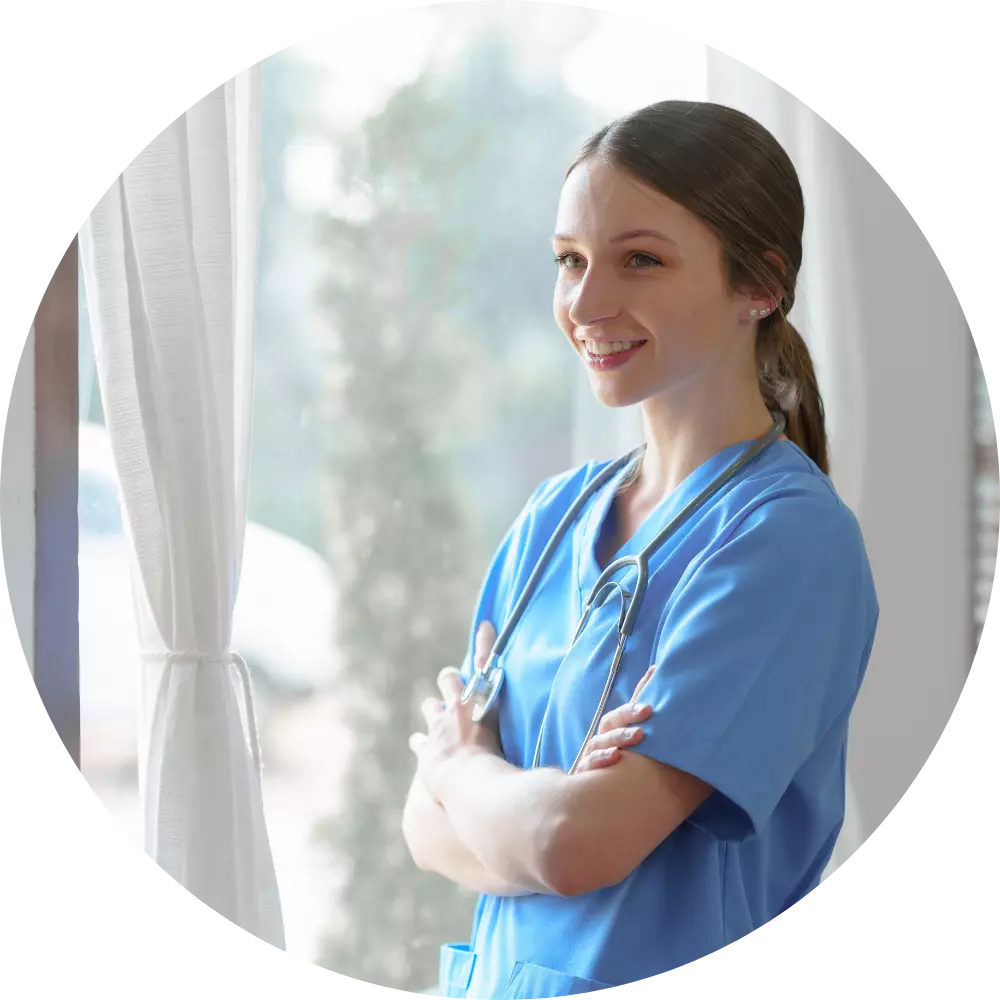 Happy nurse smiling with arms crossed